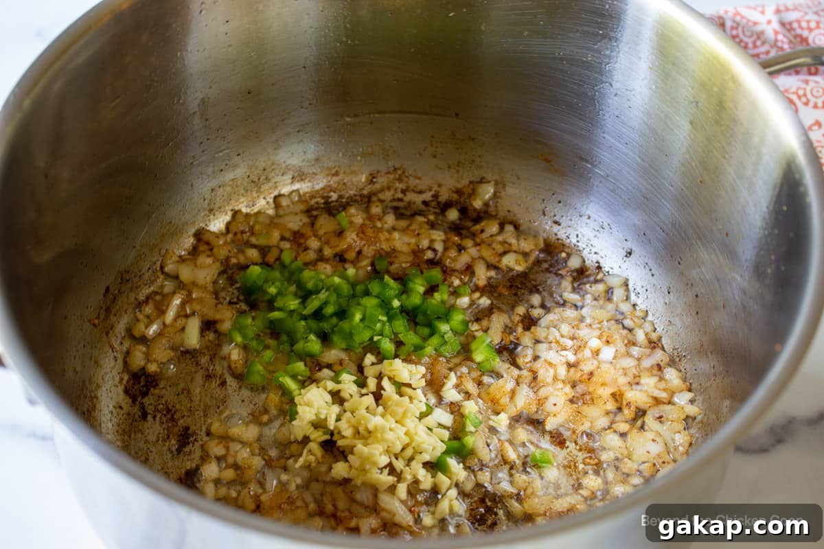 Onions, garlic and chopped jalapenos in a stock pot. 