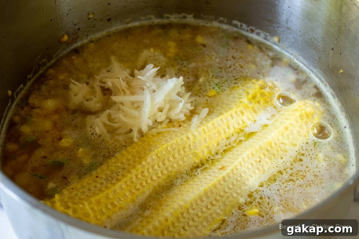 Grated potatoes in a stock pot.