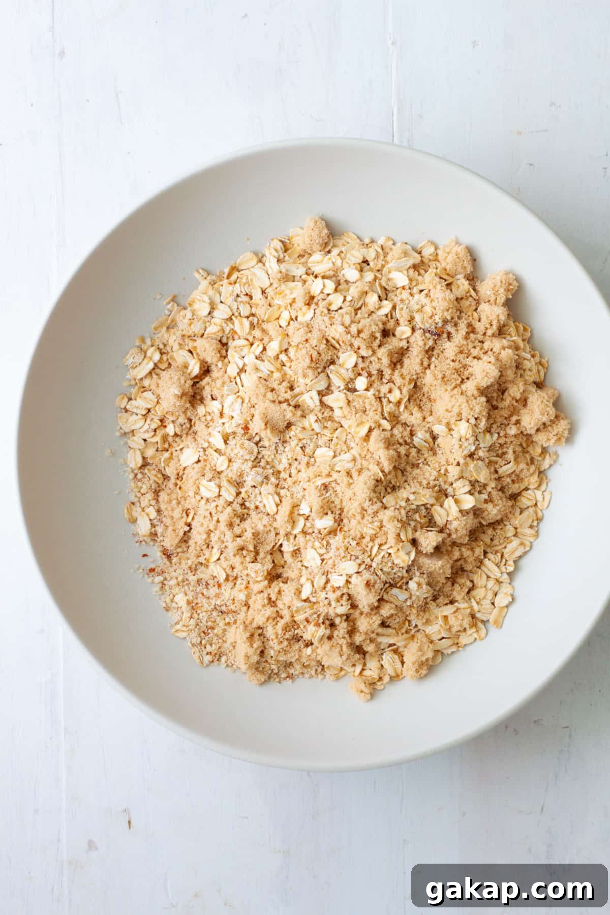 Oats and ground almonds in a mixing bowl.