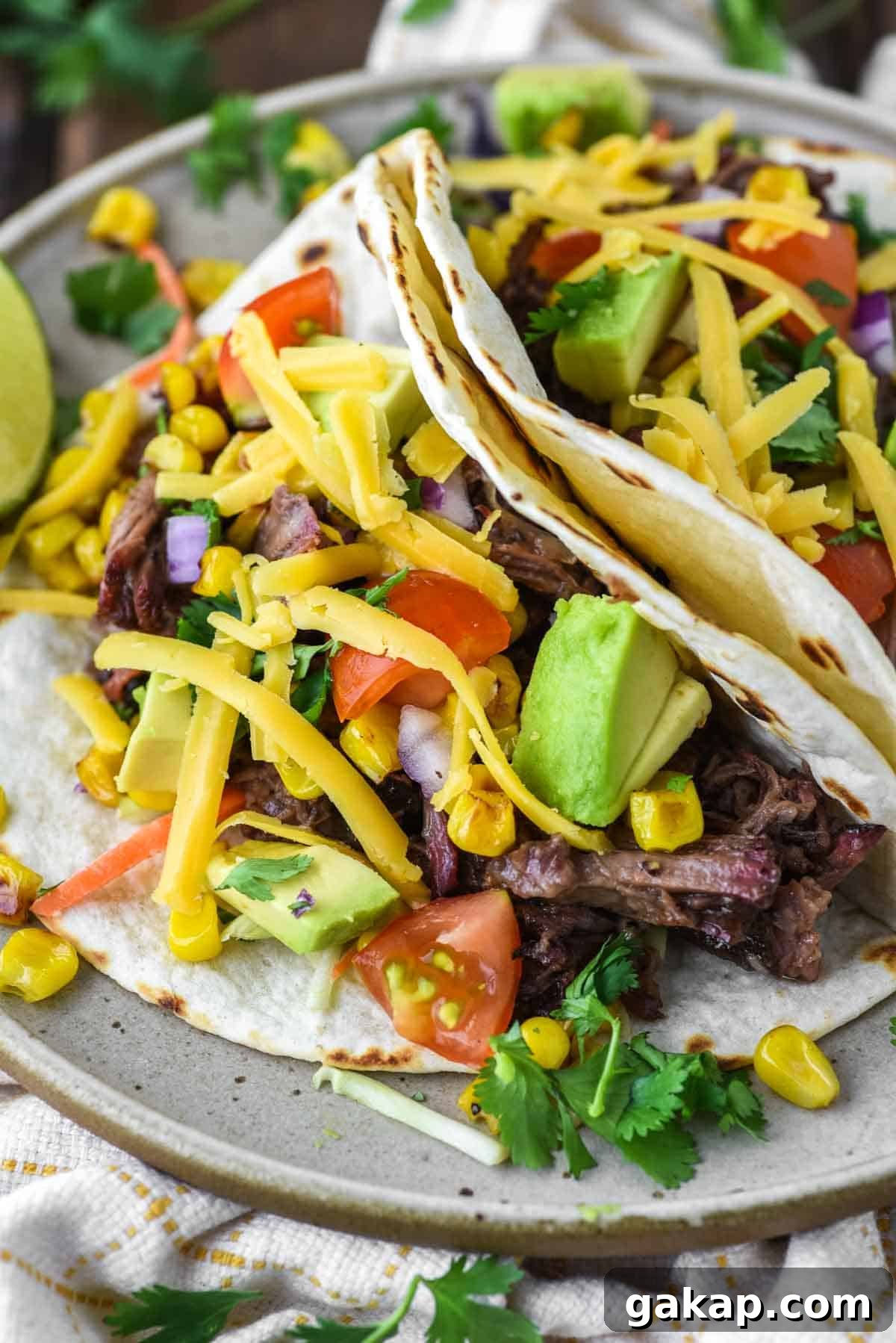 close-up of smoked pulled beef tacos on plate