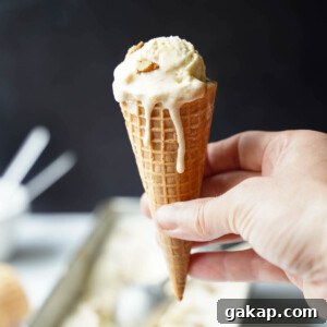 Bourbon peach ice cream in a cone