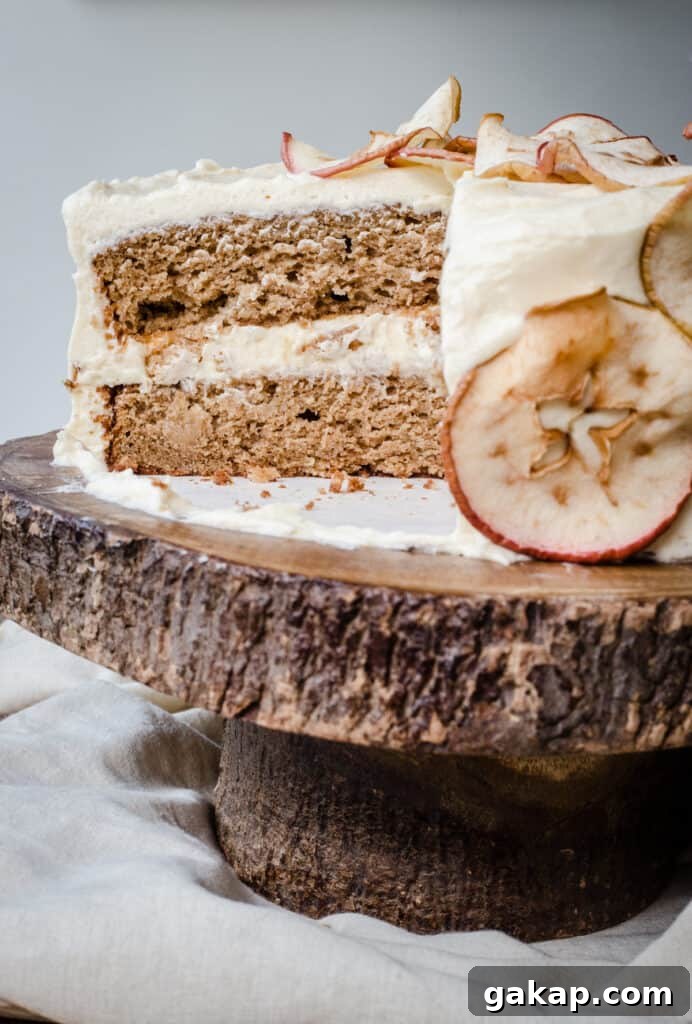 Close up of a cut Apple and Cinnamon Cake with Salted Caramel Cream Cheese Buttercream