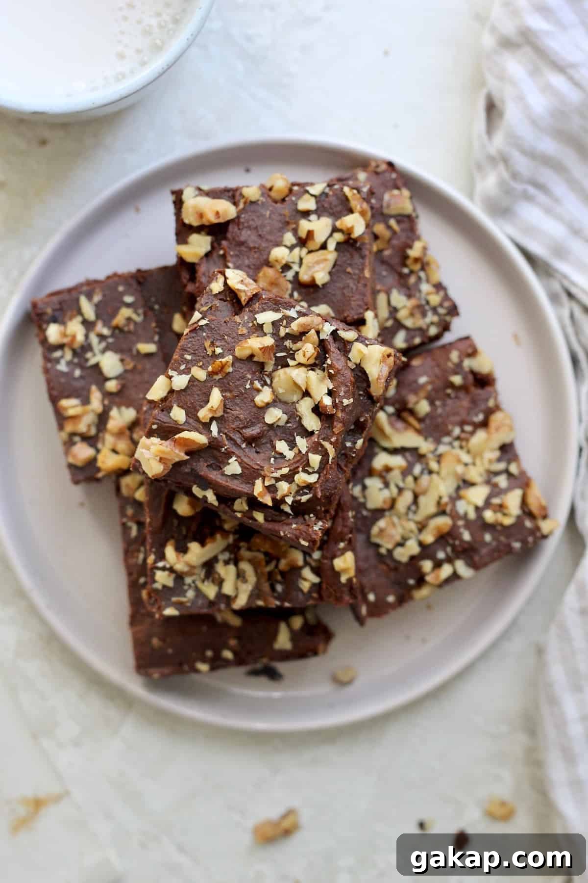 plate of brownies with walnuts.