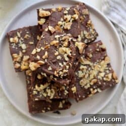 plate of brownies with walnuts.