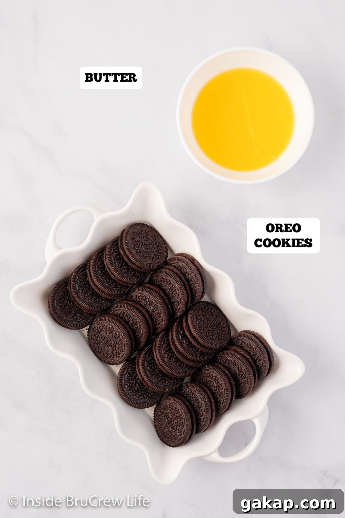 Oreo cookies and melted butter in bowls.