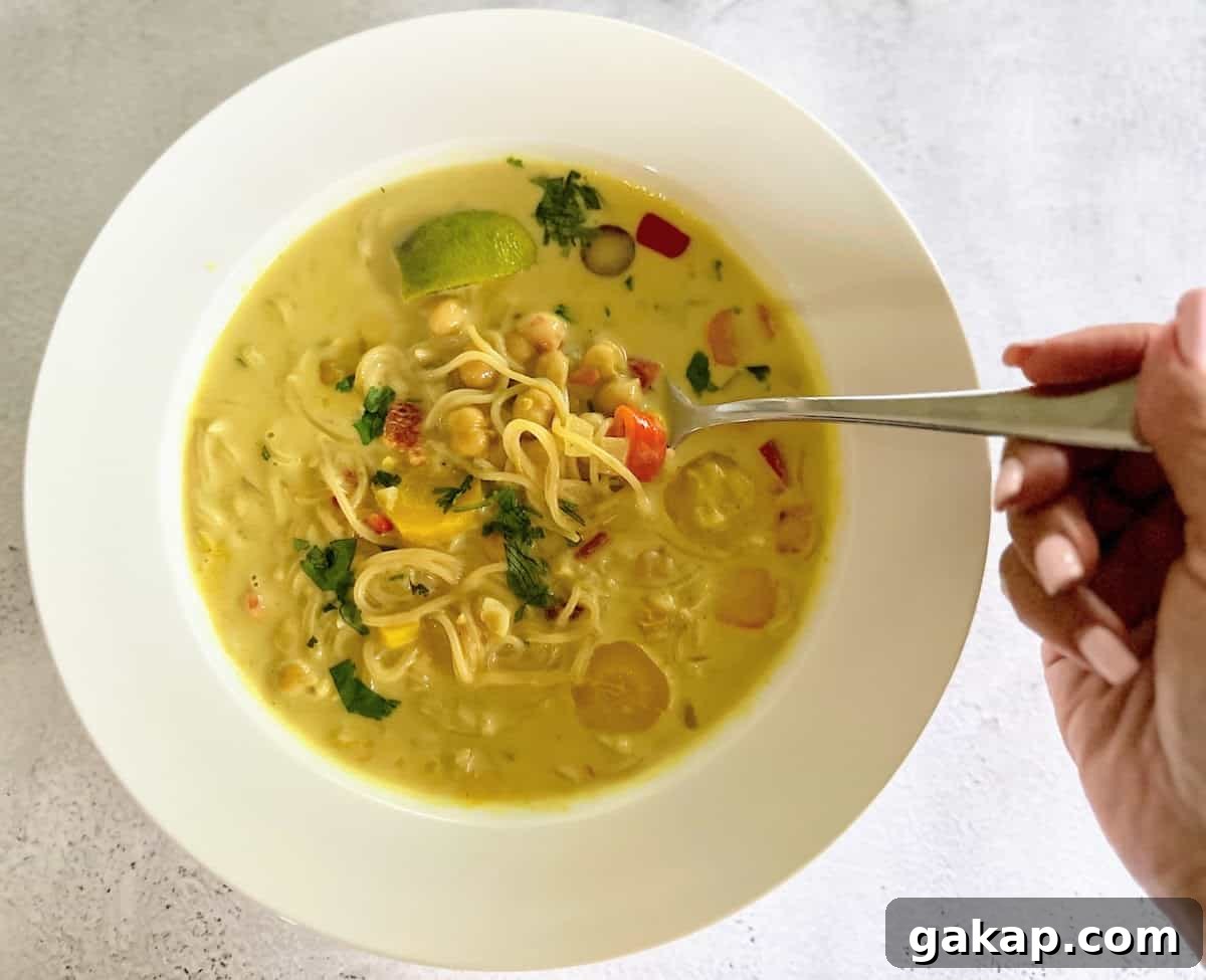 I am eating creamy ramen noodle soup. 