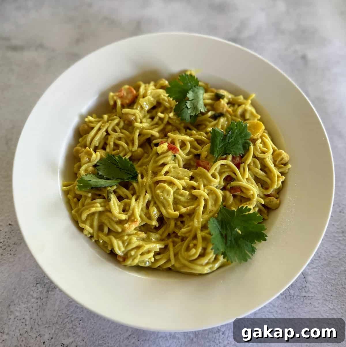 Vegan ramen noodles in a bowl garnished with cilantro. 
