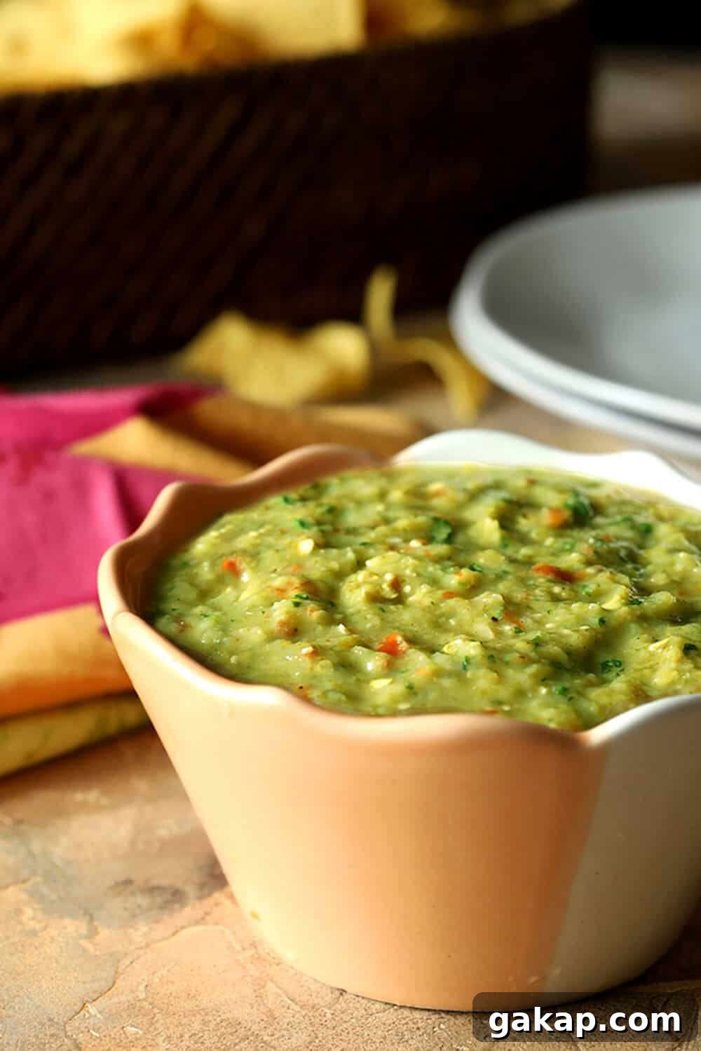 Fresh tomatillo salsa combines tomatillos, onion, garlic, lime juice, and jalapeno for a delicious and beautiful salsa.