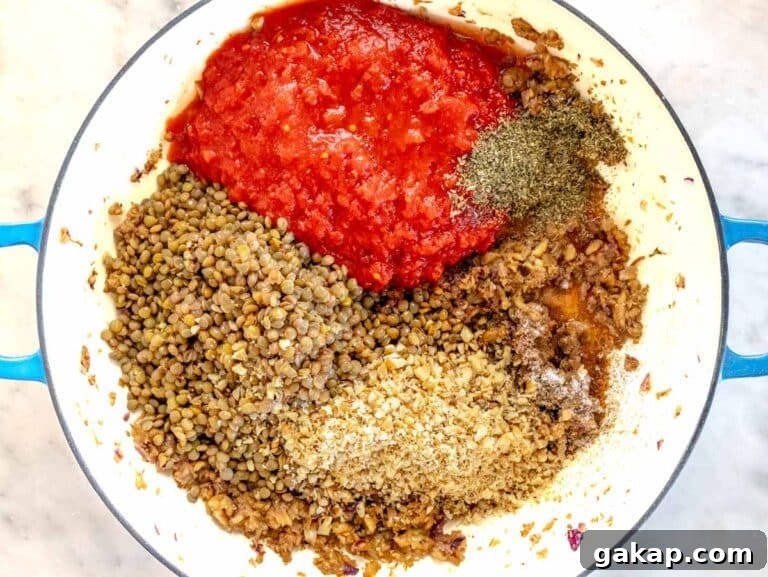all the ingredients for the filling are in a skillet about to be cooked