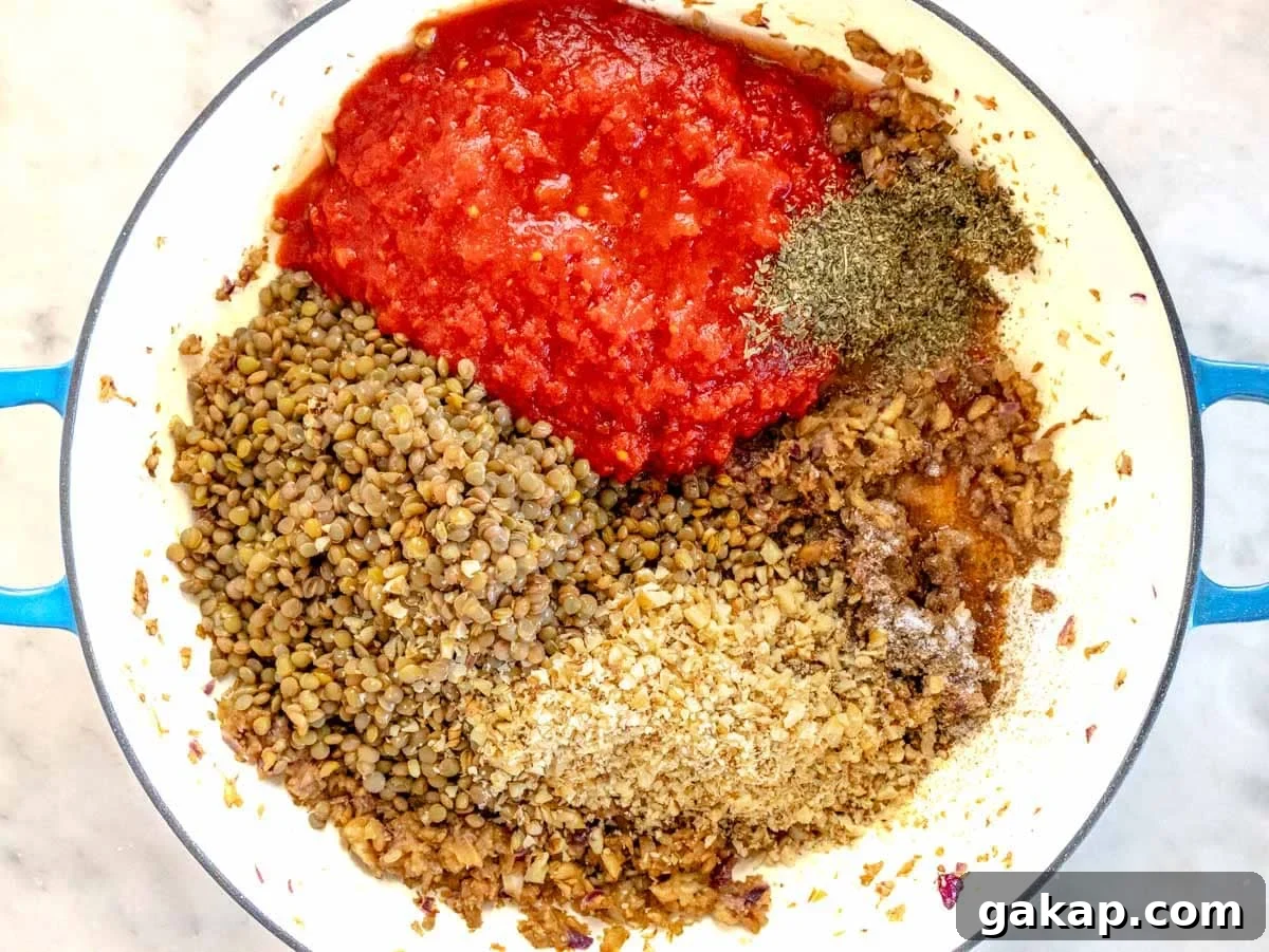 all the ingredients for the filling are in a skillet about to be cooked