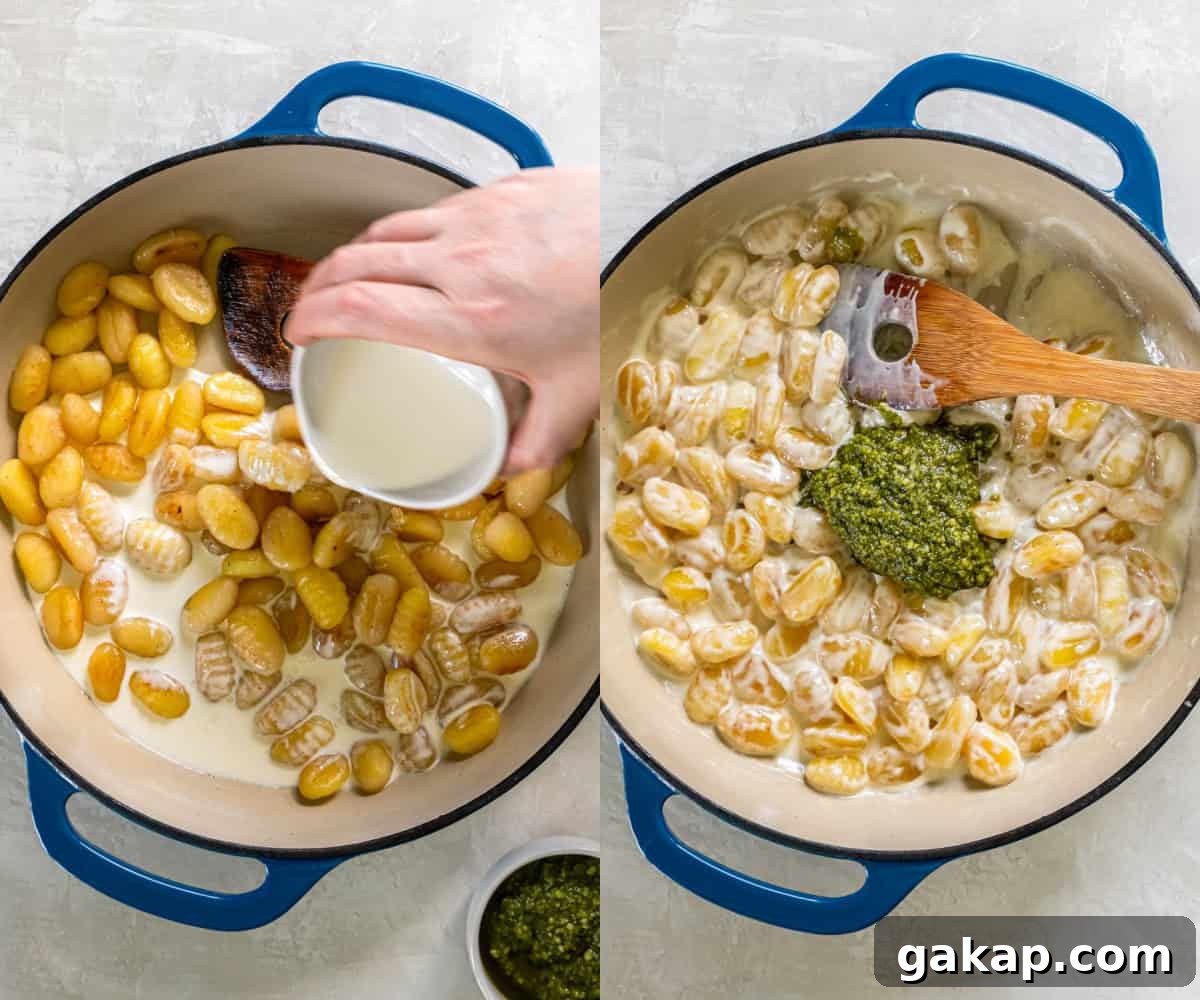 Stirring in the heavy cream and pesto to make the cream sauce and complete the recipe for pesto gnocchi.