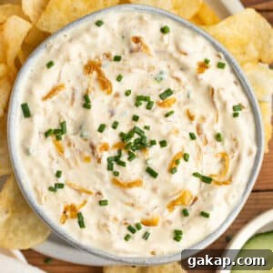 This is a square picture of a bowl filled of caramelized greek yogurt onion dip.