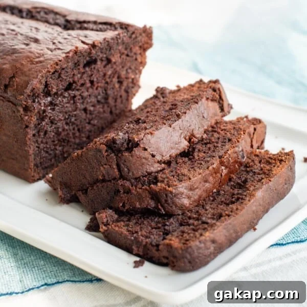 Chocolate muffin sourdough bread sliced on a platter.