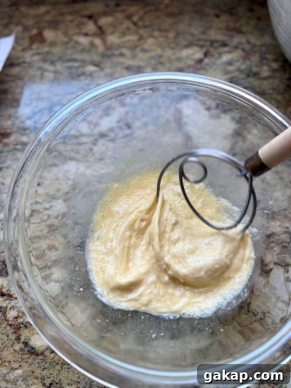 Whisking the wet ingredients until smooth and fully combined.