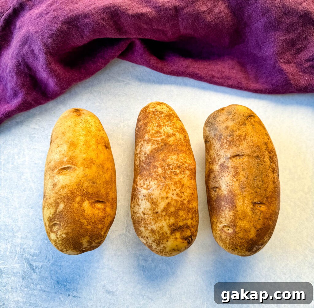 fresh russet potatoes on a flat surface
