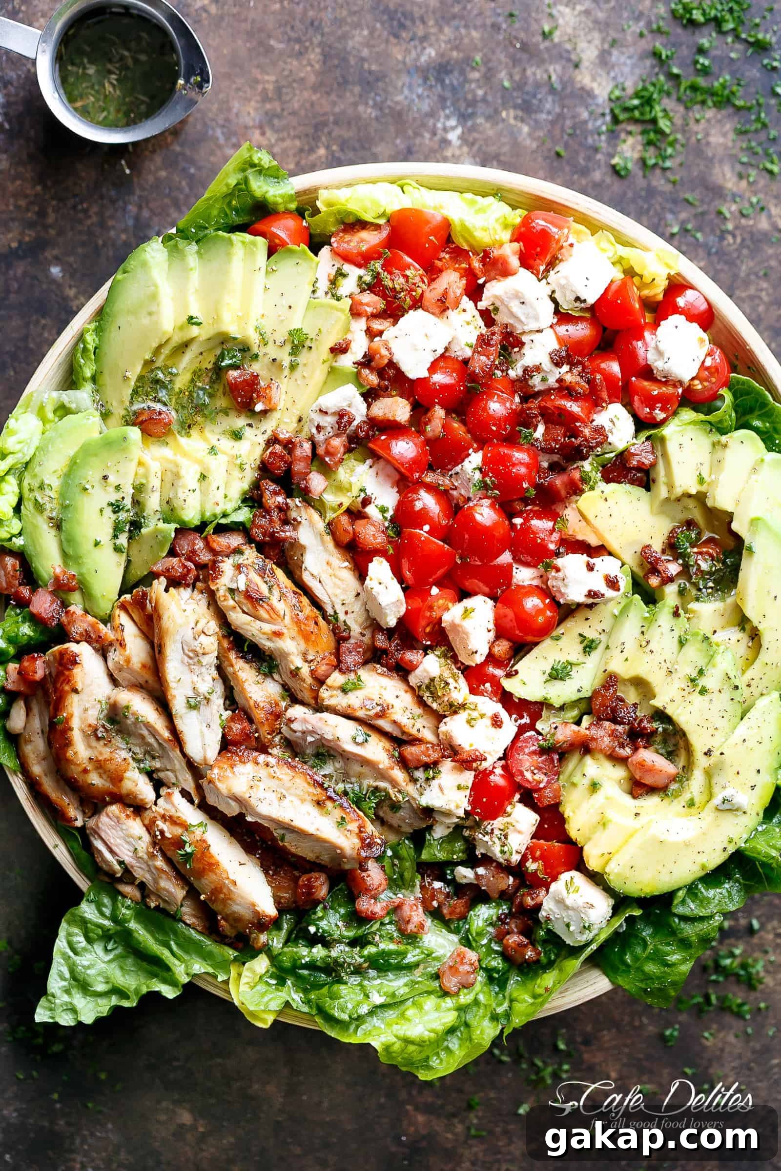 Lemon-Herb Avocado Chicken Salad Recipe for Light Lunch 2 Lemon Herb Avocado Chicken Salad Recipe with crispy bacon & creamy feta cheese on a plate