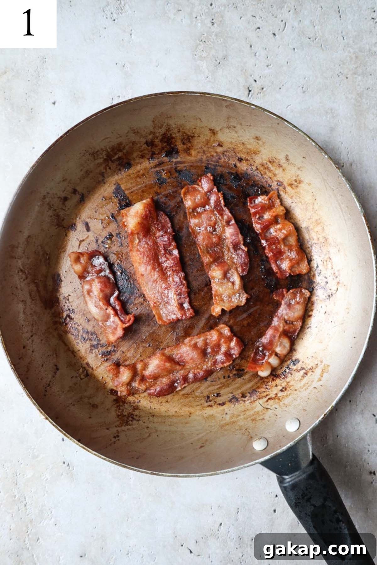 Chipotle Peach Baked Beans Recipe for Sweet-Spicy BBQ Sides 4 skillet with bacon cooked until crispy.