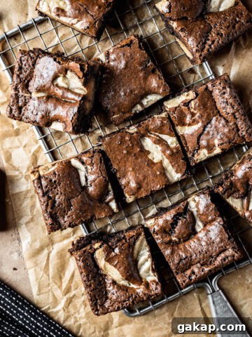 Brownie blondie squares on a cooling rack.