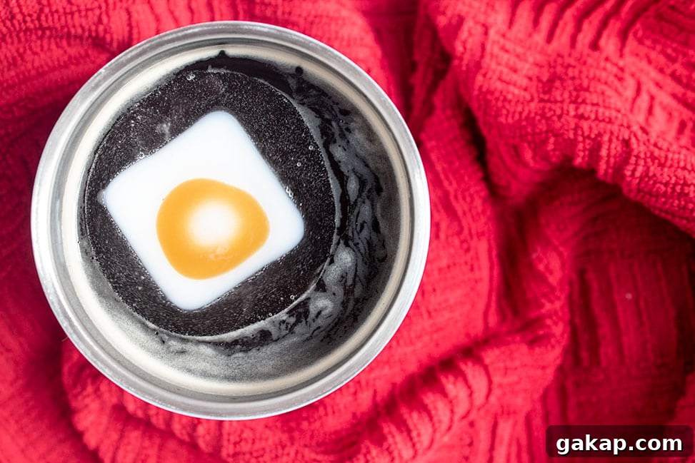 Keto Peppermint Coffee Flavor Shots — Low-Carb Fat Bombs 8 overhead shot of keto peppermint coffee with a flavor shot dissolving in the cup