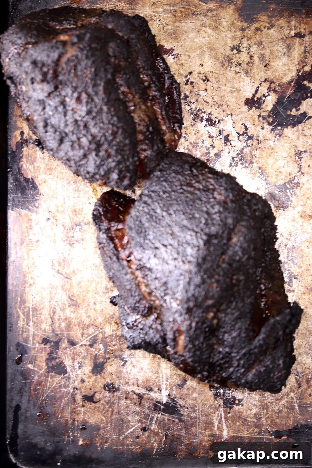 Smoky Pulled Pork Shoulder for tacos or sandwiches 2 smoked pork shoulder roasts on a sheet pan