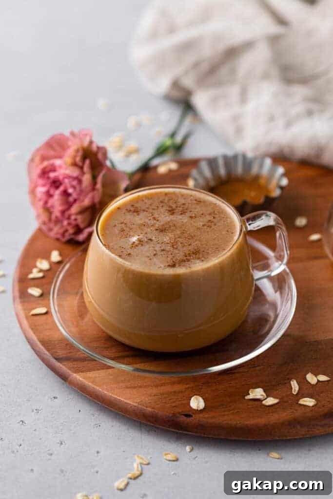 Honey Oatmilk Latte Recipe: Hot & Iced Starbucks-Style Guide 7 Cozy honey oat milk latte on a wooden tray with honey and oats, a Starbucks copycat coffee drink perfect for fall mornings.
