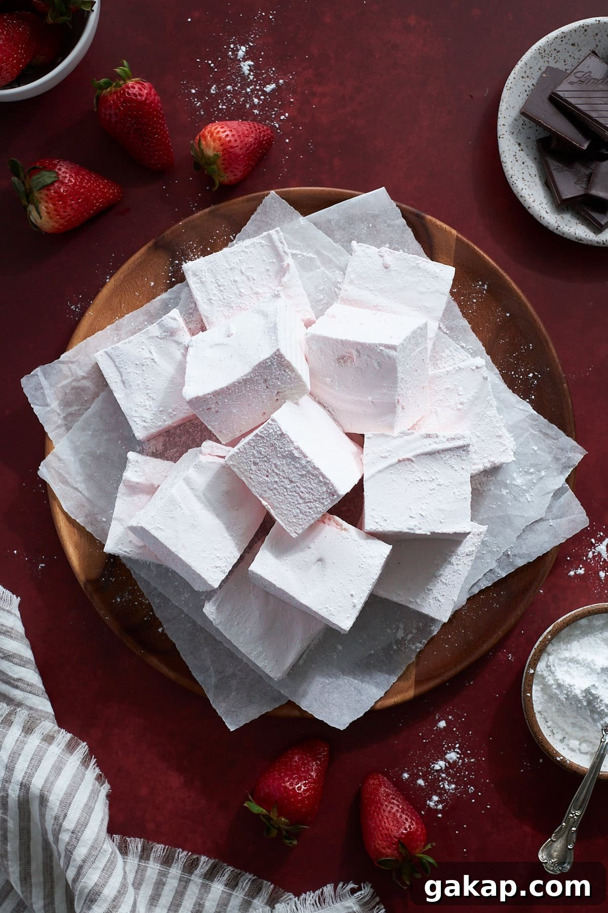 Strawberry Pink Marshmallows on a wooden platter. 