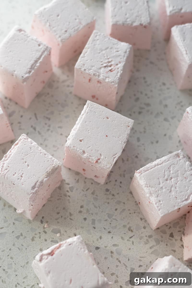 Sliced marshmallows on a work surface.
