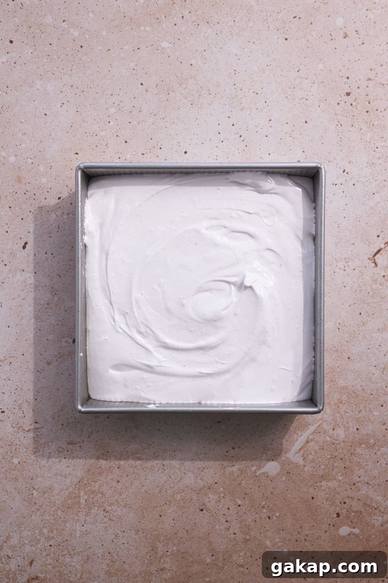 Marshmallows spread in the pan.