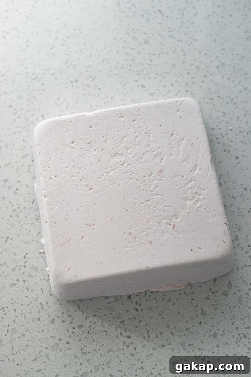 Firm marshmallow on a work surface.