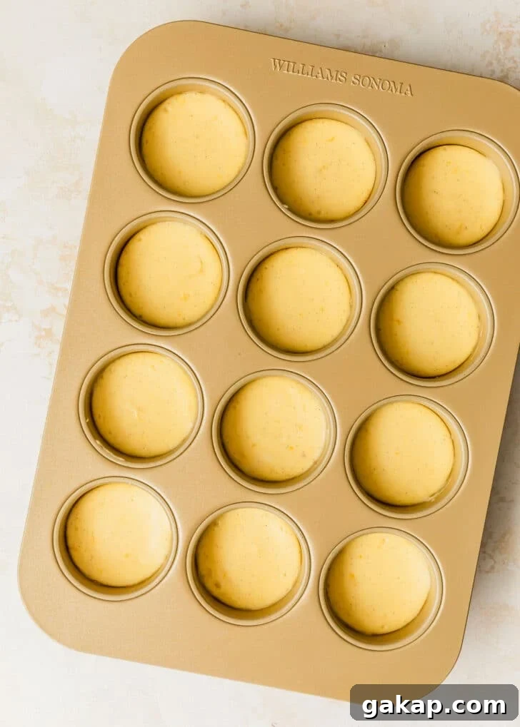 A gold pan of mini creme brulee cheesecakes.