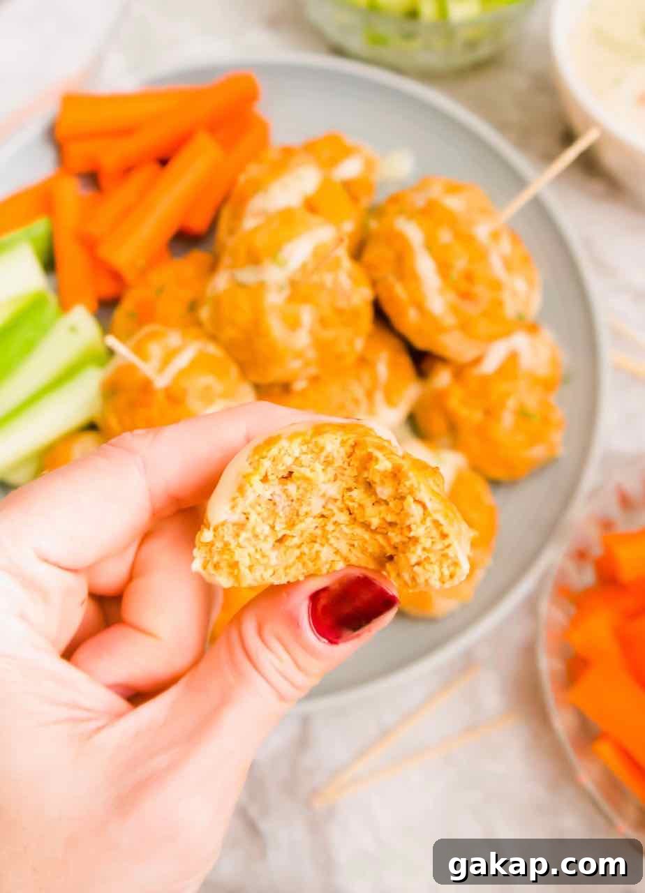 A bite taken out of a Healthy Buffalo Turkey Meatball.