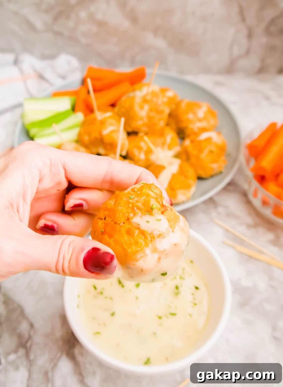 Dipping a buffalo turkey meatball into ranch.