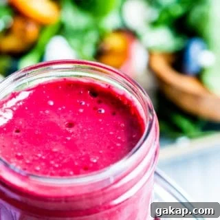 Blueberry dressing in a glass mason jar.