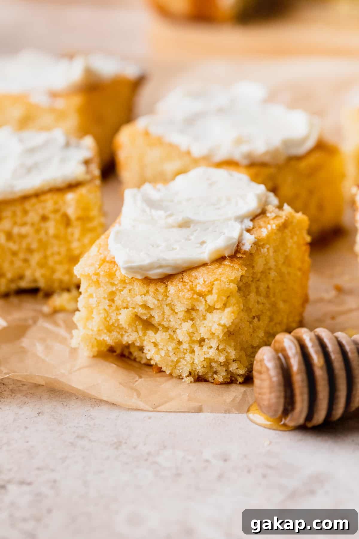 Honey butter cornbread with butter on top.