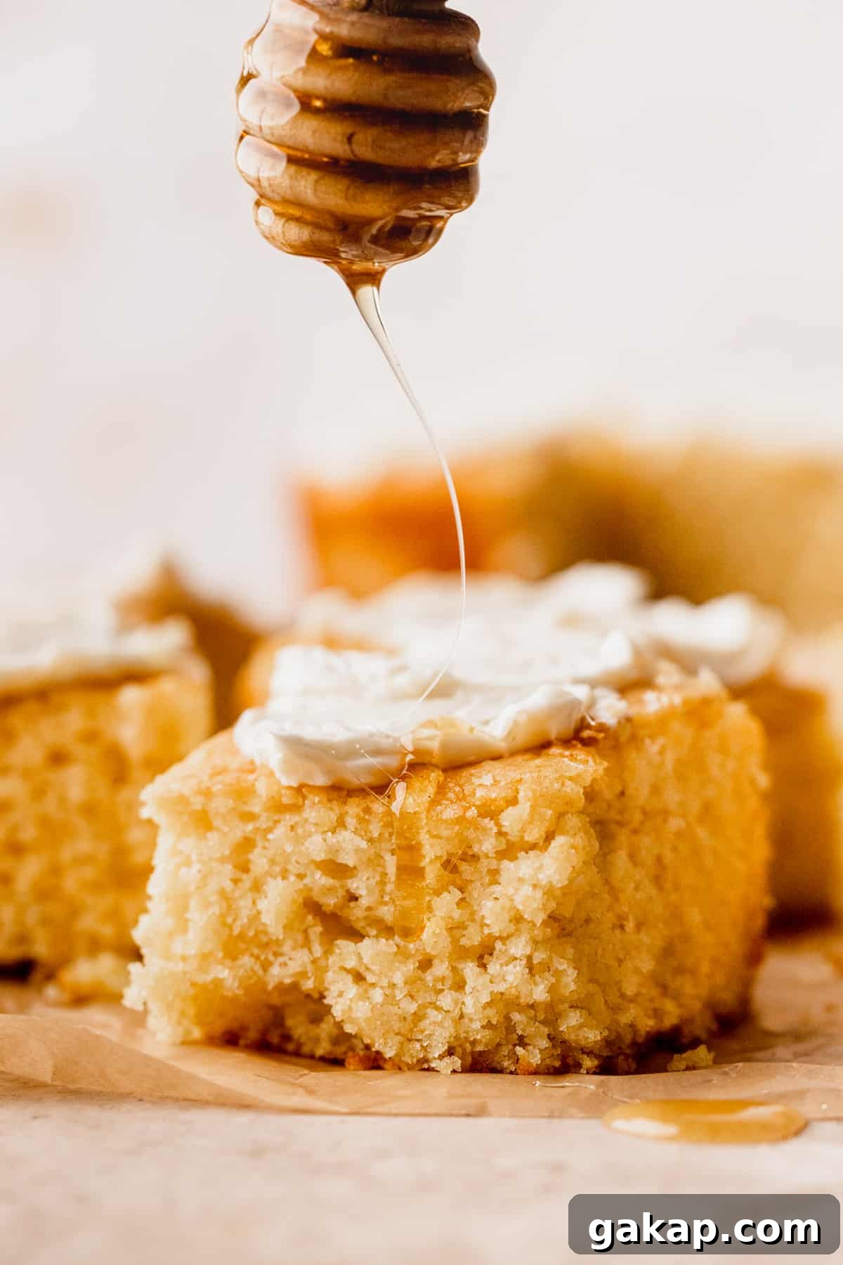 Drizzling honey on top of cornbread.