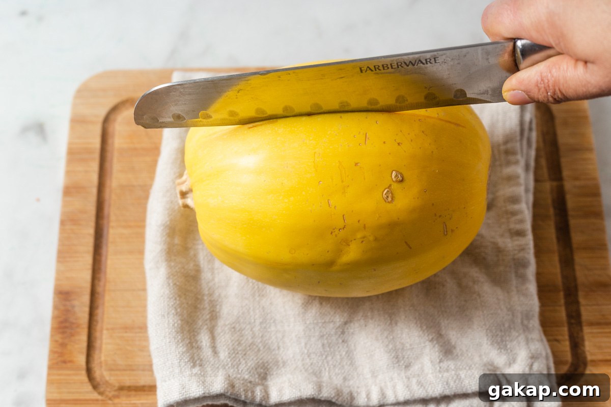 Crispy Air-Fried Spaghetti Squash Recipe for Quick Dinners 4 making a slit on the spaghetti squash.