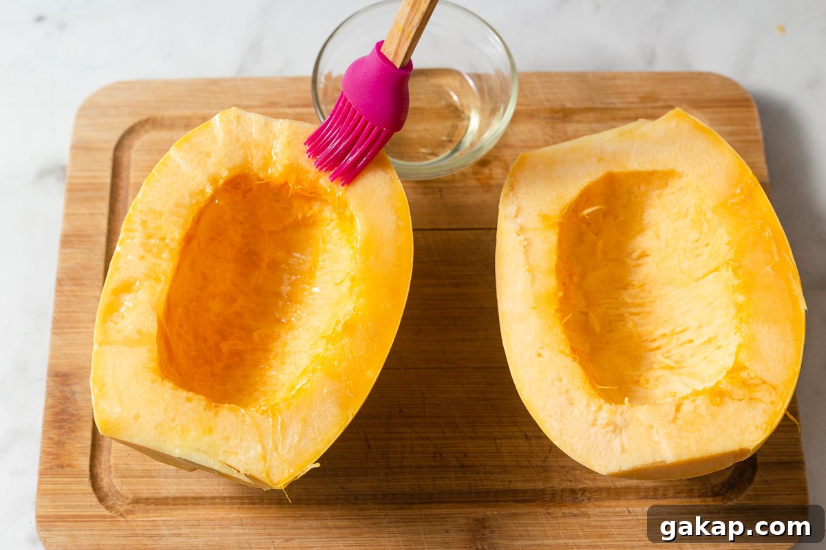 Crispy Air-Fried Spaghetti Squash Recipe for Quick Dinners 6 brushing oil on spaghetti squash.