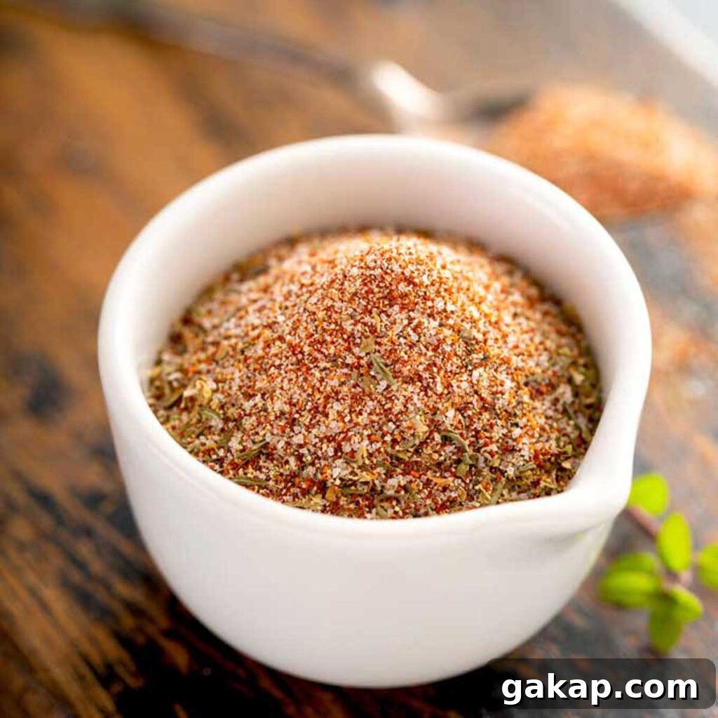 A white bowl filled with homemade cajun seasoning mix