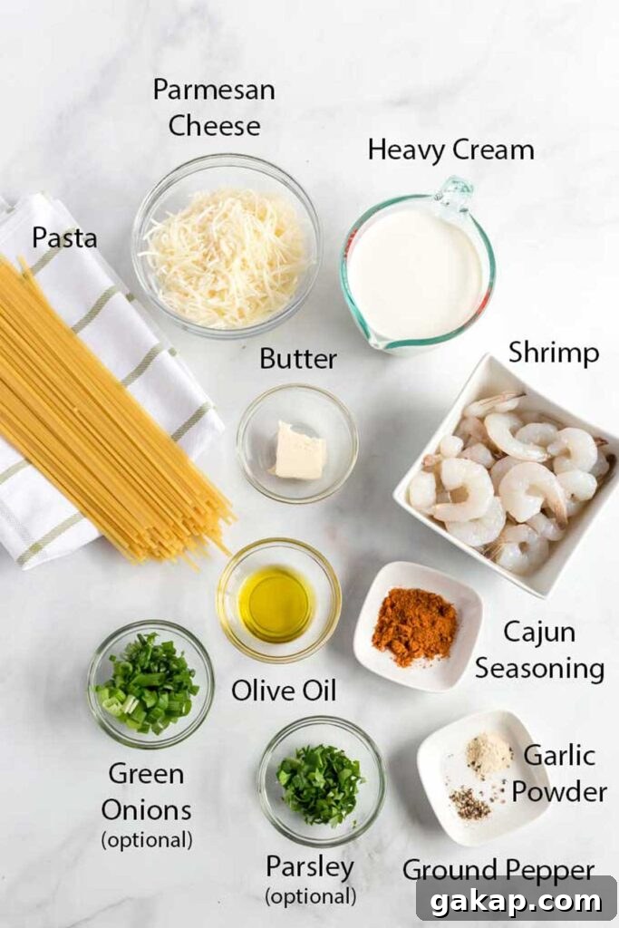All ingredients needed to make spaghetti with shrimp and Cajun Alfredo sauce