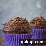 Vegan Chocolate Cupcakes Recipe for Two—Moist Single-Serving Treat 2 Two vegan chocolate cupcakes in purple cake cases.