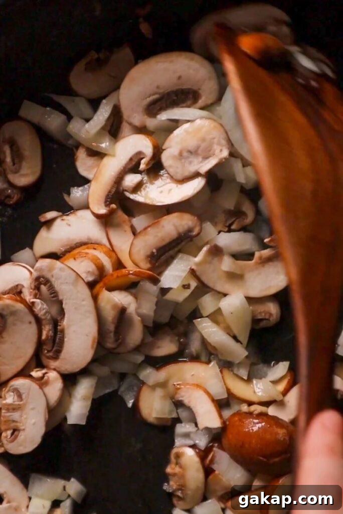 Creamy Mushroom Garlic Gravy for Hamburgers 2 mushroom and onions in frying pan