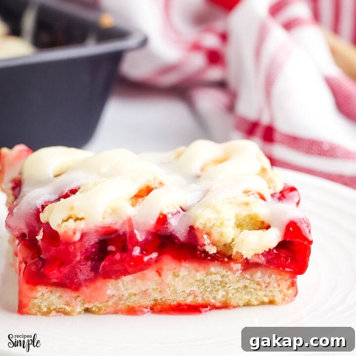 Cherry Pie Bar with Cream Cheese glaze on white plate