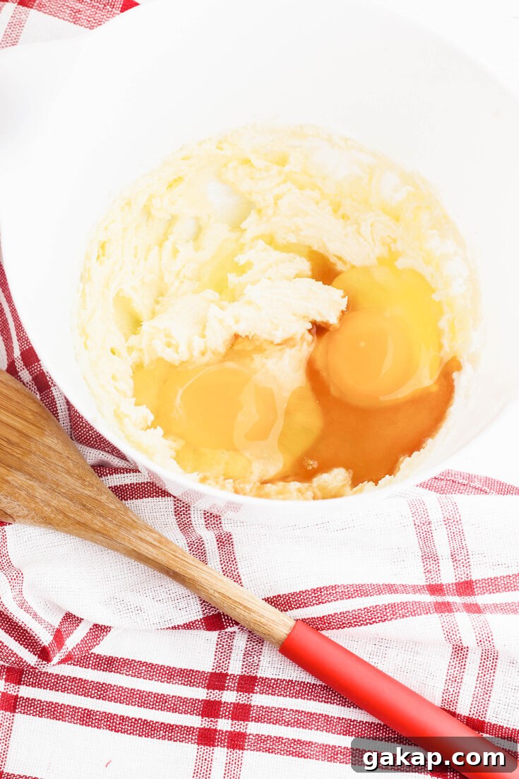 Sugar, butter, eggs and vanilla in mixing bowl