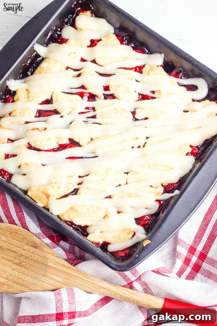 Cherry Pie Bars With Cream Cheese Glaze in Baking Pan