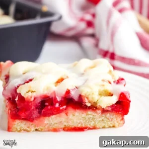 Cherry Pie Bar with Cream Cheese glaze on white plate