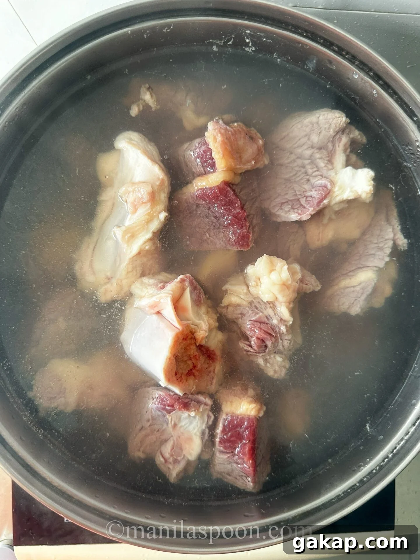 Blanching oxtail, tripe and beef chunks
