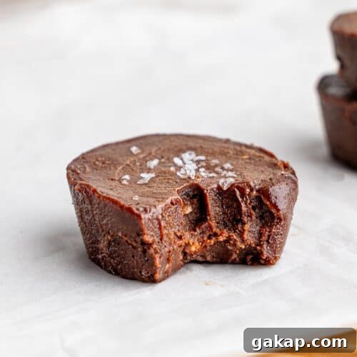 A half-eaten chocolate fudge cup.