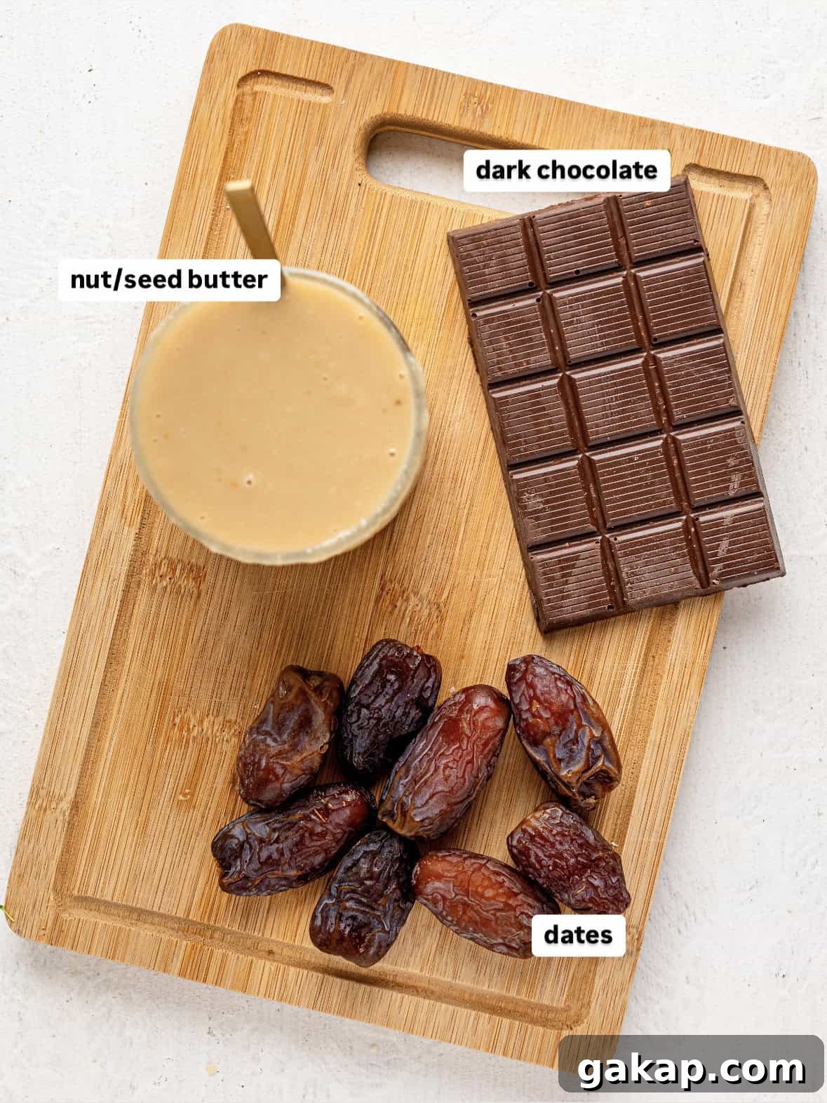 Ingredients to make chocolate freezer fudge on a wooden chopping board.