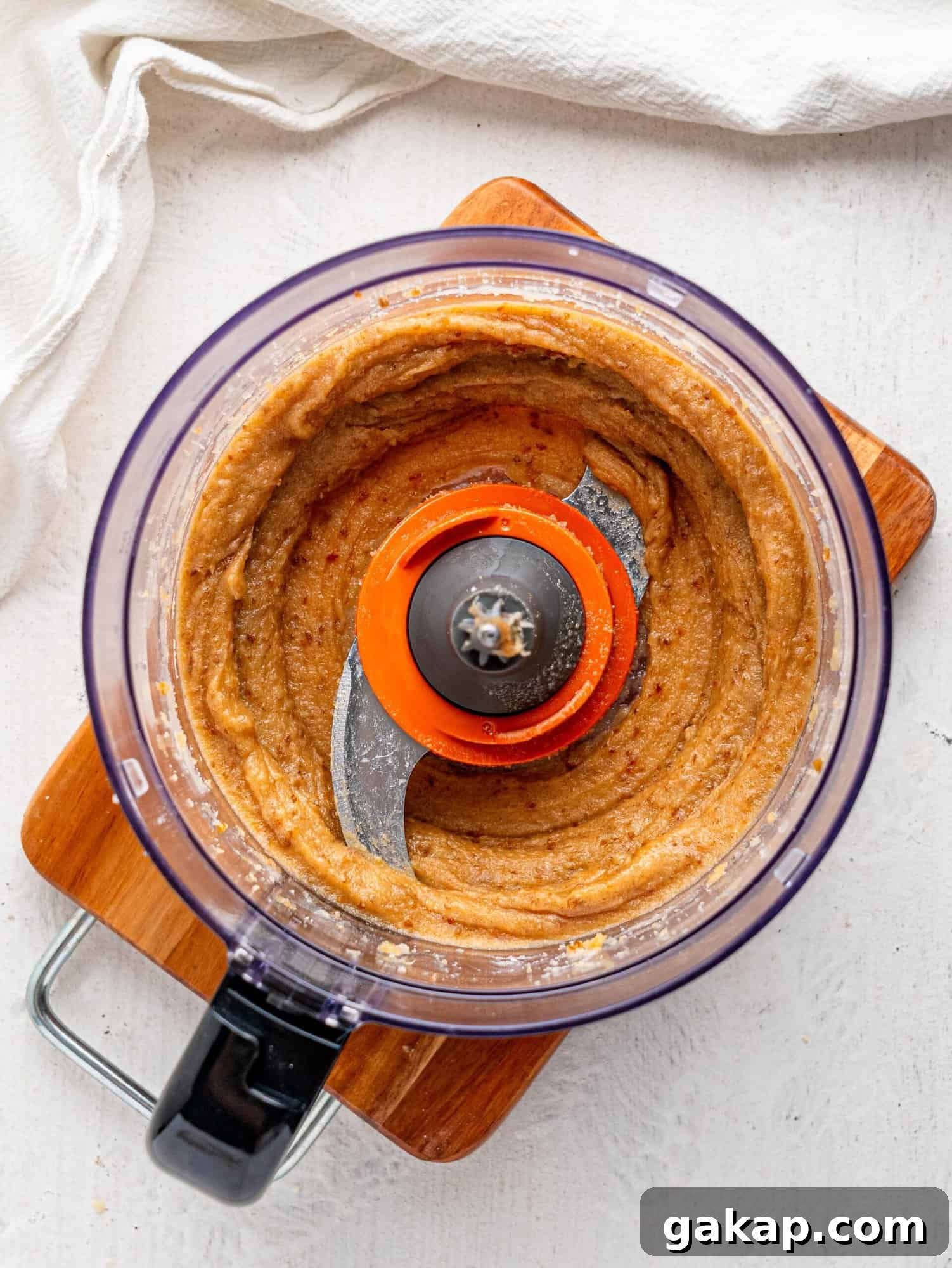 Blended dates and nut butter in a food processor.