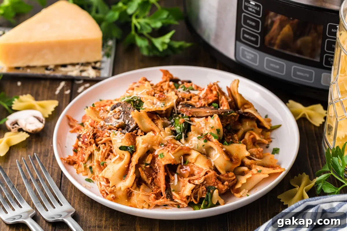 Creamy Slow Cooker Chicken and Bacon Pasta Recipe 8 slow cooker chicken bacon pasta on a white plate.